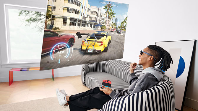 Concept photo of a person playing a video game wearing the Rokid Max AR glasses