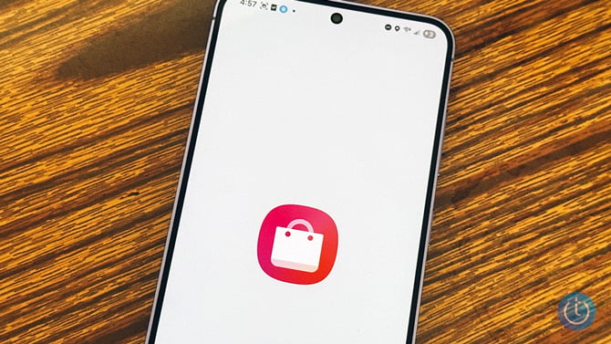 Samsung Galaxy phone shows the Galaxy Store icon.
