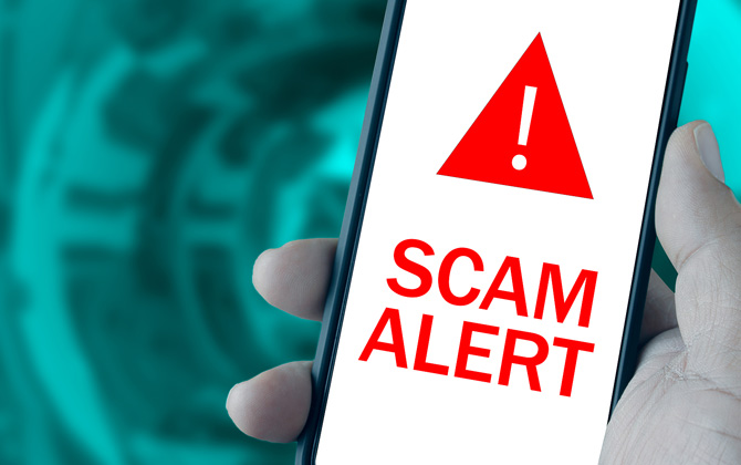 Phone showing Scam Alert message