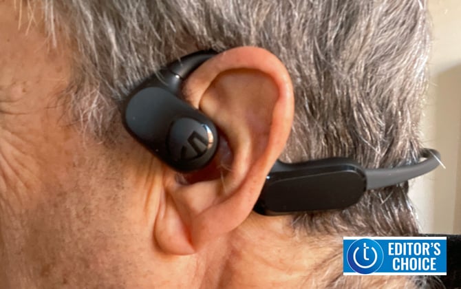 Soundpeats RunFree Open Ear Sport Headphones shown on a person. The Techlicious Editors Choice award logo is in the lower right corner.