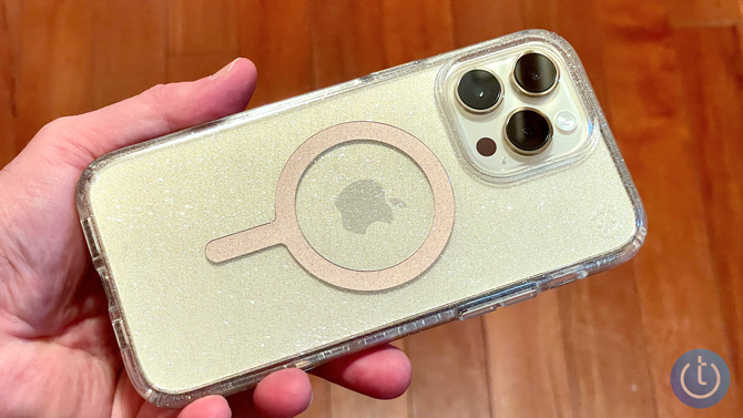 Speck Perfect-Clear Glitter case shown from the back in a hand.