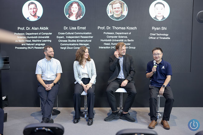 Seated panel showing Dr Alan Akbik, Dr. Lisa Ernst, Prof Dr. Thomas Kosch, and Ryan Shi