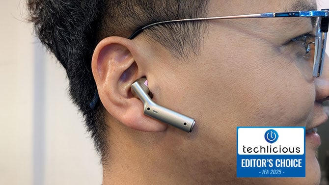  Timekettle W4 AI Interpreter Earbud is shown in ear. The Techlicious Editor's Choice Award logo is in the lower left.