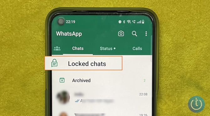 Android phone showing a list of WhatsApp chats with Locked chats highlighted.