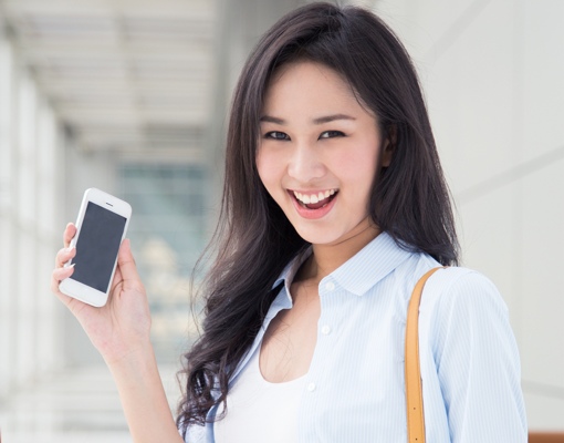 Happy woman with smartphone