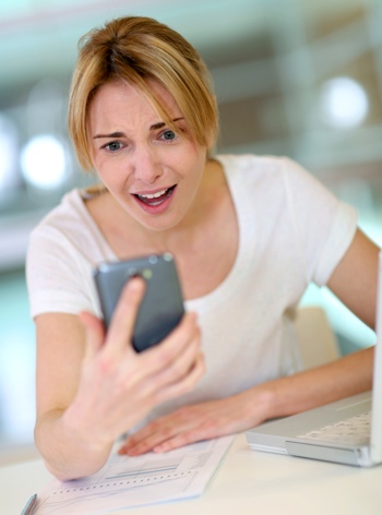 Woman shocked at smartphone
