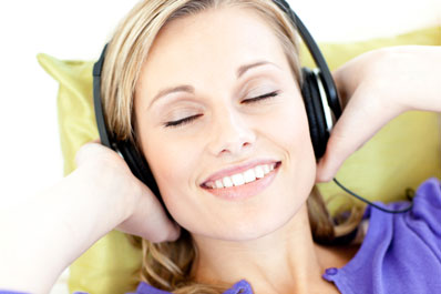 woman listening to music - Shutterstock