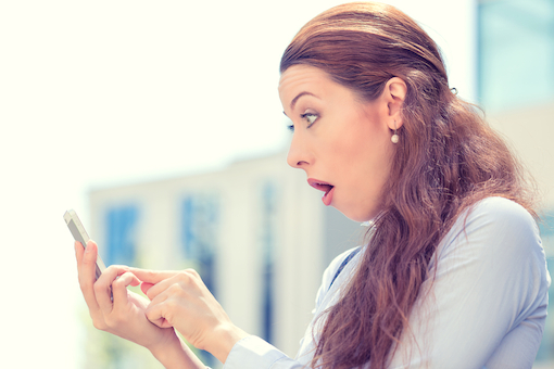 Woman shocked at smartphone