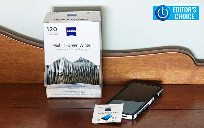 Zeiss Mobile Screen wipes 120 count box on table with iPhone 11 Pro. One wipe packet is leaning up against the iPhone.