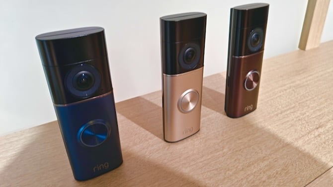 photo of three ring wired doorbell models with 4k video camera and ai