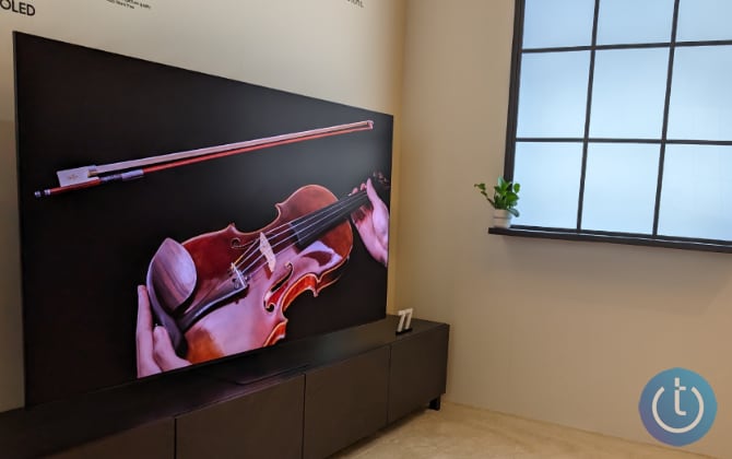 Samsung S95D TV next to a window